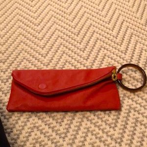 Orange leather wristlet/clutch by Mud Pie.